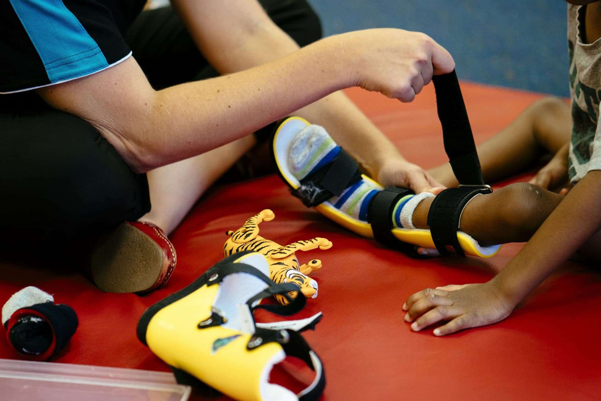 Picture of Physiotherapist adjusting a young child's leg brace